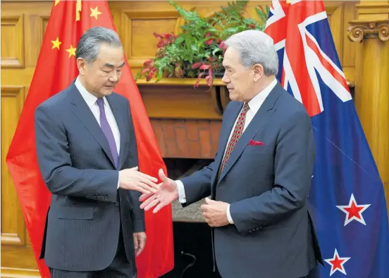 ?? Photo / Getty Images ?? China’s Foreign Minister Wang Yi (left) and Foreign Affairs Minister Winston Peters meet in Wellington yesterday.