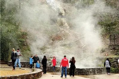  ?? The Sentinel-Record/File photo ?? ■ Steam rises from the pool at the base of the thermal water cascade on Arlington Lawn in March 2019.