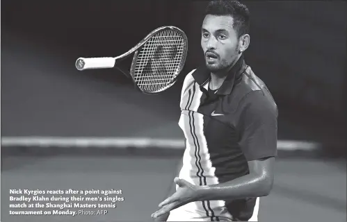  ?? Photo: AFP ?? Nick Kyrgios reacts after a point against Bradley Klahn during their men’s singles match at the Shanghai Masters tennis tournament on Monday.