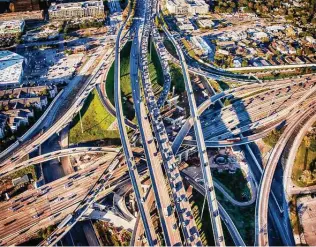  ?? Art Wager / Getty Images ?? Texas’ highways and roads got a D-plus from the American Society of Civil Engineers in its 2021 report card. The infrastruc­ture plan passed by Congress includes $26.9 billion for Texas roads.