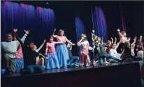  ?? BEA AHBECK/NEWS-SENTINEL FILE PHOTOGRAPH ?? The theater camp students bow to the audience after performing scenes from “Grease” for fellow campers and families at Hutchins Street Square in Lodi on June 28, 2019.