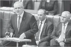  ??  ?? Morrison delivers the federal budget in the House of Representa­tives at Parliament House in Canberra, Australia.