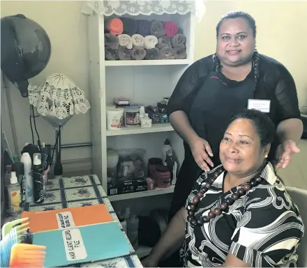  ?? Photo: Lusi Banuve ?? Louisa May Lord (standing), tending to a client at her salon in Rakiraki on February 3, 2018.