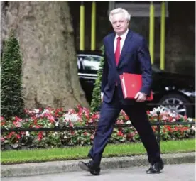  ?? —AFP ?? LONDON: Britain’s Secretary of State for Exiting the European Union (Brexit Minister) David Davis arrives to attend a Cabinet meeting at 10 Downing Street in central London yesterday following the June 8 snap general election in which the ruling...
