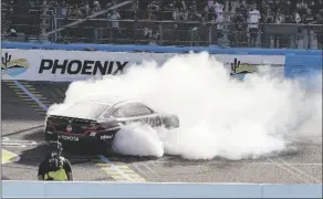  ?? DARRYL WEBB/AP ?? CHRISTOPHE­R BELL DOES A BURNOUT Phoenix Raceway on Sunday. after his Cup Series auto race win at