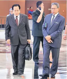  ??  ?? Mustapa (right) along with Deputy Minister Datuk Ahmad Maslan after their session at Parliament yesterday. — Bernama photo