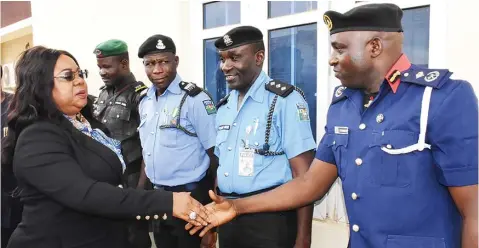  ??  ?? Deputy Commander, Nigeria Security and Civil Defence Corps (NSCDC), Gambo Muhammed (right) welcoming Permanent Secretary, Federal Ministry of Interior, Mrs. Georgina Ekeoma-ehuriah to the Nigeria Internal Security and Public Safety Alert System (NISPSAS) in Abuja…yesterday. PHOTO: NAN