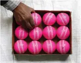  ??  ?? JALANDHAR: An Indian cricket ball maker packs pink cricket balls at the Chhaju Ram manufactur­ing workshop in Jalandhar on Saturday. In an historic day-night Test, Australia will chase 187 runs to win after dismissing New Zealand for 208 on the third...