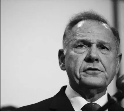  ?? BRYNN ANDERSON / AP ?? Former Alabama Chief Justice and U.S. Senate candidate Roy Moore speaks at a news conference Thursday in Birmingham, Ala. Moore is facing calls from within his own party to withdraw from the campaign following a series of accusation­s regarding Moore’s...