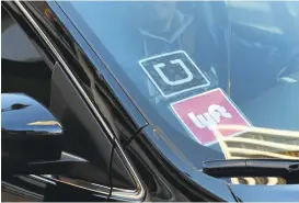  ?? RICHARD VOGEL/ASSOCIATED PRESS ARCHIVES ?? Concerns over rider safety have long plagued Uber and Lyft. Earlier this year, Uber agreed to pay up to $25 million to settle a lawsuit accusing the company of misleading passengers about the strength of its background checks.