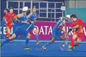  ?? PTI ?? ■ India and Japan players vie for the ball during their Pool A match.