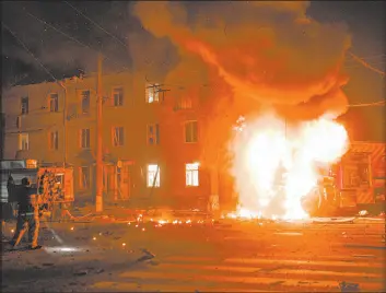  ?? George Ivanchenko The Associated Press ?? A fire engine burns after a Russian drone strike in Kharkiv, Ukraine, on Thursday.