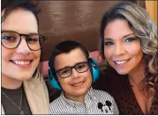  ?? SUBMITTED FILE PHOTO ?? Erica Hammel McLaughlin, left, with her son, Wyatt, and Christyne Kadlitz, whose child was abused by the same woman who abused Wyatt, in 2022at the state Capitol in Lansing after Wyatt’s Law was passed.