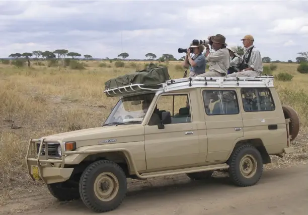  ??  ?? The writer at the wheel of a Troopy leading a safari in Tanzania.