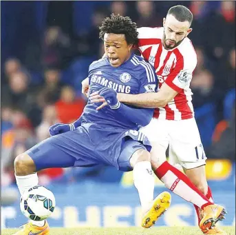  ??  ?? Chelsea’s French striker Loic Remy (left), vies with Stoke City’s Northern Irish-born Irish defender Marc Wilson (right), during the English Premier League football match between Chelsea and Stoke City at Stamford Bridge in London on
April 4. (AFP)