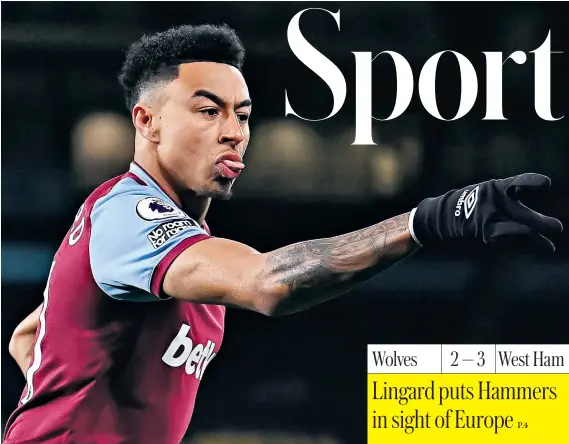  ??  ?? Jesse Lingard celebrates opening the scoring for West Ham at Molineux last night, as the on-loan forward continued his remarkable run of form since joining David Moyes’s side