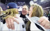  ?? Matt Slocum / Associated Press ?? Patriots head coach Bill Belichick, center, celebrates with his son Steve Belichick, left, and daughter Amanda Belichick after winning Super Bowl XLIX in 2015.