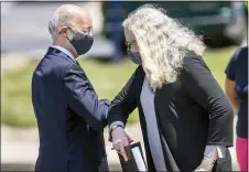  ?? JOE HERMITT — THE PATRIOT-NEWS VIA AP ?? Pennsylvan­ia Gov. Tom Wolf greets Secretary of Health
Dr. Rachel Levine with an elbow bump during a press conference outside UPMC Pinnacle Community Osteopathi­c Hospital in Lower Paxton Twp. on June 29, 2020.