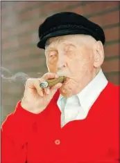  ??  ?? Christian Mortensen at 114 years-old credited his longevity to “friends, a good cigar, drinking lots of good water, no alcohol, staying positive and lots of singing.”