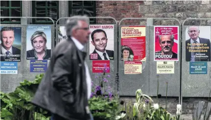  ?? Philippe Huguen / AFP ?? Campaign posters of presidenti­al candidates in Bailleul, northern France, two days before the first round of the election.