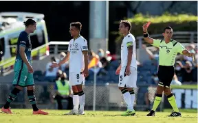  ?? GETTY IMAGES ?? Phoenix midfielder Alex Rufer is sent off after tangling with Macarthur rival Denis Genreau, above and left, last night in Sydney. At right, Nix striker David Ball fires in a shot.