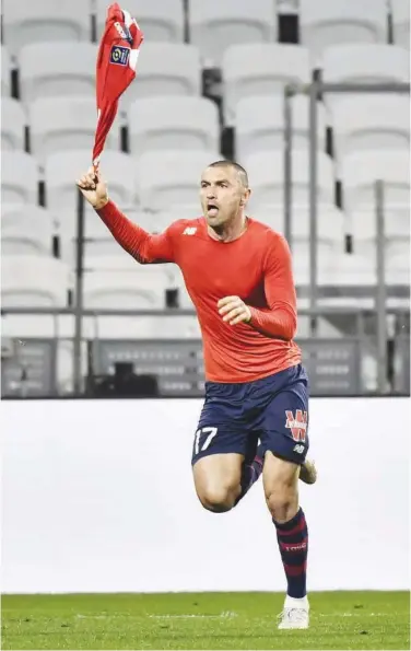  ?? Agence France-presse ?? Lille’s Burak Yilmaz celebrates after scoring a goal against Olympique Lyonnais during their French League match on Sunday.