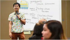  ?? AFP ?? Preserving a heritage: Wong conducting a Kristang language class at the national library board in Singapore. —