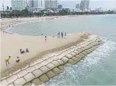  ??  ?? BIGGER LOOK: Northern Pattaya beach in Chon Buri, now widened by constructi­on of a sandfill to combat natural erosion.