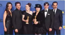  ??  ?? (From left) Marin Hinkle, Michael Zegen, Rachel Brosnahan, Amy Sherman-Palladino, Daniel Palladino and Tony Shalhoub pose with the award for Best Television Series Musical or Comedy for “The Marvelous Mrs Maisel.”