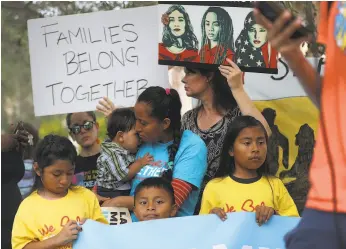  ?? Joe Raedle / Getty Images ?? Protesters rally outside the ICE detention facility in Miramar, Fla., on the National Day of Action for Children on June 1. Cover photo: Two children look at a federal detention denter holding migrant women June 9 in SeaTac, Wash.