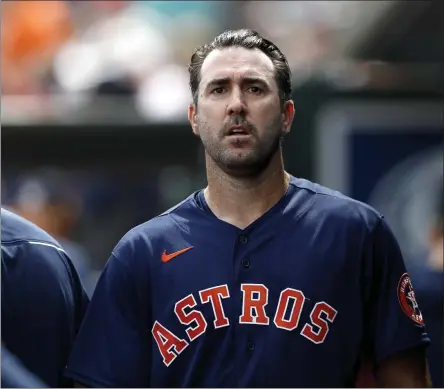  ?? JULIO CORTEZ - THE ASSOCIATED PRESS ?? Houston Astros pitcher Justin Verlander walks in the dugout after pitching to the St. Louis Cardinals in the first inning of a spring training baseball game, Tuesday, March 3, 2020, in Jupiter, Fla.