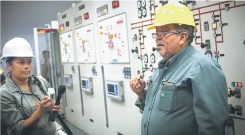  ??  ?? Cortez, head of operations at the Ahuachapán Geothermal Plant, in western El Salvador, explains the process of energy production using the heat under the earth’s surface, during a tour by experts and representa­tives of government­s of the region through...