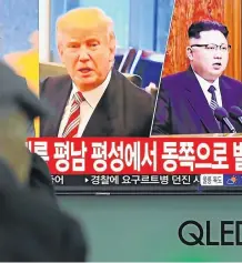  ?? Picture: AFP ?? MAKING HIS MOVE: People watch a television news screen showing pictures of US President Donald Trump and North Korean leader Kim Jong-Un, right, at a railway station in Seoul yesterday