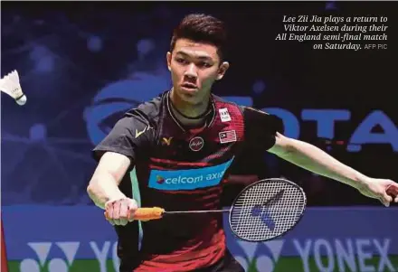  ?? AFP PIC ?? Lee Zii Jia plays a return to Viktor Axelsen during their All England semi-final match on Saturday.