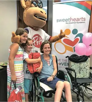  ?? Picture: SUPPLIED ?? RIGHT BEHIND YOU MOM: Angi Wienekus in the new wheelchair she received last week thanks to the public’s collection of bottle tops and bread tags. She is supported by her children Hannah, 10, and Alex, 6