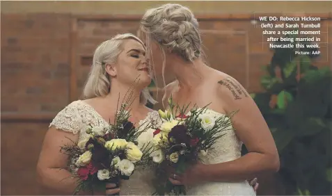  ?? Picture: AAP ?? WE DO: Rebecca Hickson (left) and Sarah Turnbull share a special moment after being married in Newcastle this week.