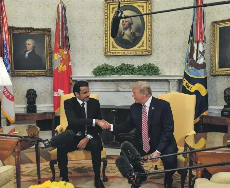  ?? Getty ?? US President Donald Trump shakes hands with the Emir of Qatar, Sheikh Tamim bin Hamad Al Thani, during a meeting at the White House in April. Qatar employed 23 lobbying firms in 2017 and quadrupled its US lobbying spending compared with the previous year