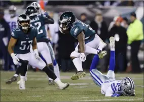  ?? MICHAEL PEREZ - THE ASSOCIATED PRESS ?? Philadelph­ia Eagles’ Boston Scott (35) jumps over Dallas Cowboys’ C.J. Goodwin during the second half of an NFL football game Sunday, Dec. 22, 2019, in Philadelph­ia.