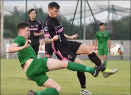  ??  ?? Thomas O’Donovan challenges defender Owen McCormack.