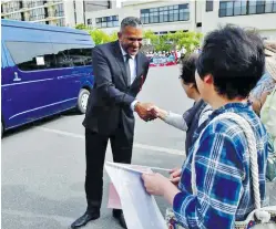  ??  ?? Minister for Industry, Trade, Tourism, Lands and Mineral Resources Faiyaz Koya and Prime Minister Voreqe Bainimaram­a greeted by well wishers before the PALM8 summit in Iwaki, Japan.