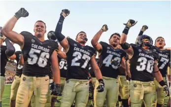  ?? DUSTIN BRADFORD, GETTY IMAGES ?? Colorado players sing the school’s fight song after their 56-7 win vs. Idaho State on Saturday.
