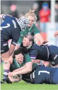  ??  ?? Bad day: Ireland’s Paula Fitzpatric­k is tackled by Sarah Bonar, above, and Lana Skeldon of Scotland