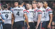  ?? ?? The dejected Roosters during their flogging at the hands of Penrith. NRL Imagery