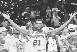  ?? DAVID J. PHILLIP/ AP ?? Tim Duncan helped turn the Spurs almost as soon as he entered the league, winning the first of five NBA championsh­ips in his second year.