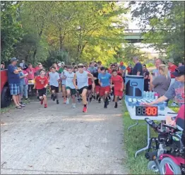  ??  ?? BULLDOG 5K RACE: Runners from around the area took off on the Silver Comet Trail for the Bulldog 5K, a fundraisin­g run for the Cedartown Cross Country team that started near the entrance of Kimoto Tech and continued on down the trail.