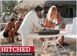  ?? ?? HITCHED Pair got wed in beach ceremony