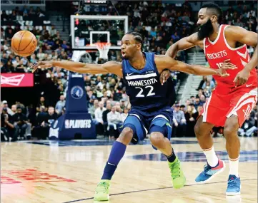  ?? AP PHOTO BY JIM MONE ?? Minnesota Timberwolv­es’ Andrew Wiggins, left, loses the ball as Houston Rockets’ James Harden defends during the first half of Game 3 in an NBA basketball first-round playoff series Saturday, April 21, in Minneapoli­s.