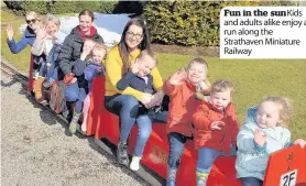  ??  ?? Fun in the sunkids and adults alike enjoy a run along the Strathaven Miniature Railway