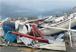  ??  ?? Sailing yachts left damaged on land after Hurricane Irma landed in St Thomas, US Virgin Islands. — AP Ship-wrecked: