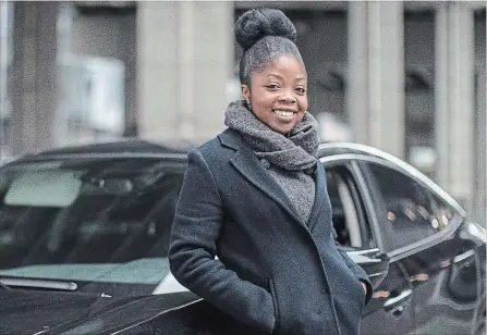  ?? CHRIS YOUNG THE CANADIAN PRESS ?? Aisha Addo, founder of DriveHer, a ride-hailing service for women, stands by a car in Toronto on Saturday.